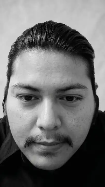 Black-and-white close portrait of Julian Espinoza